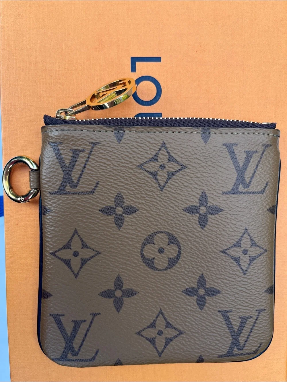 Louis Vuitton LV monogram reverse square pouch from Trio Pouch
